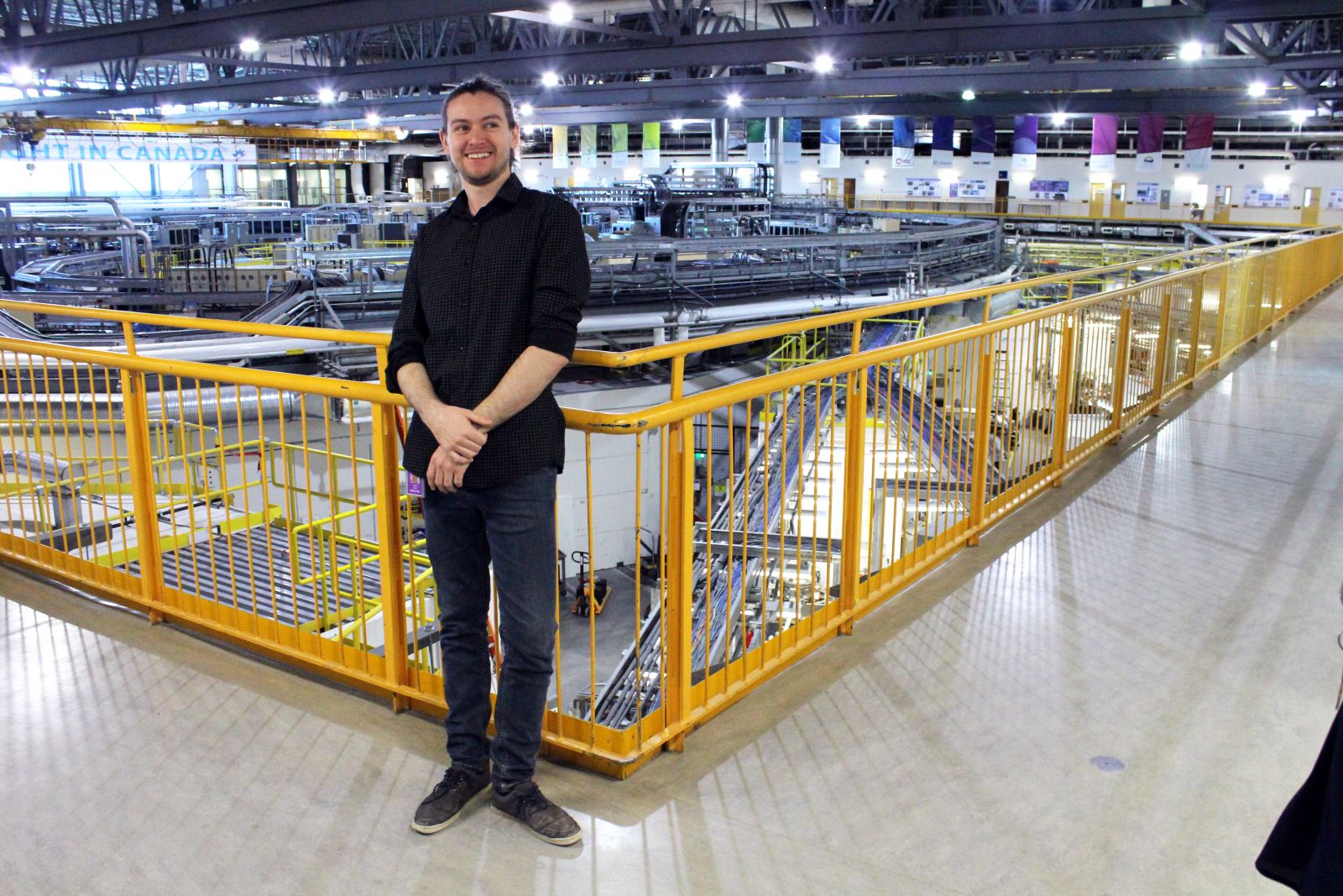 CLS Plant Imaging Lead Jarvis Stobbs in front of the synchrotron.