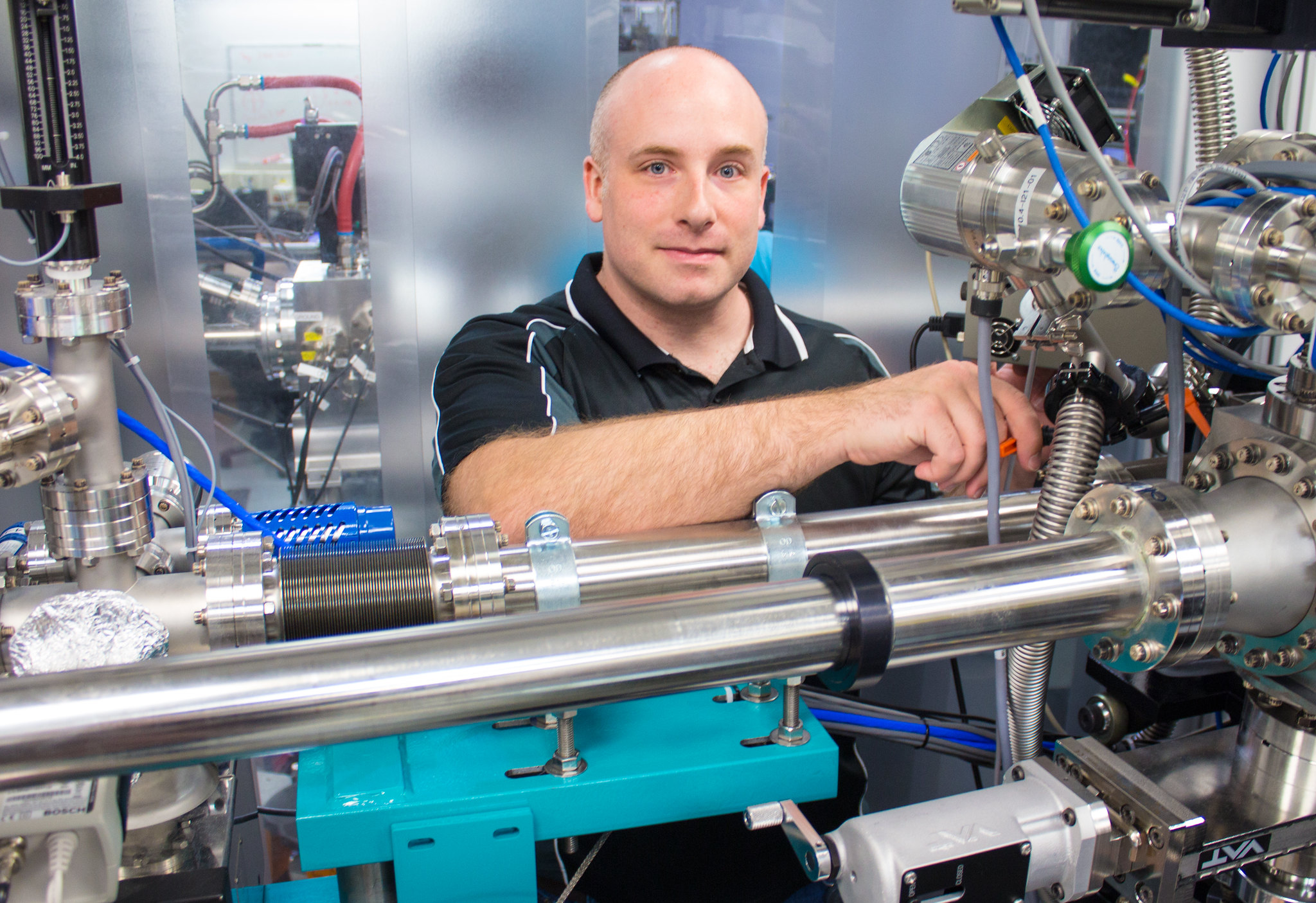 University of Saskatchewan researcher Adrian hunt conducts experiments on the REIXS beamline at the Canadian Light Source synchrotron. Hunt is currently working as a postdoctoral researcher at North Carolina State University under Dr. Harald Ade. Photo by Mark Ferguson. 