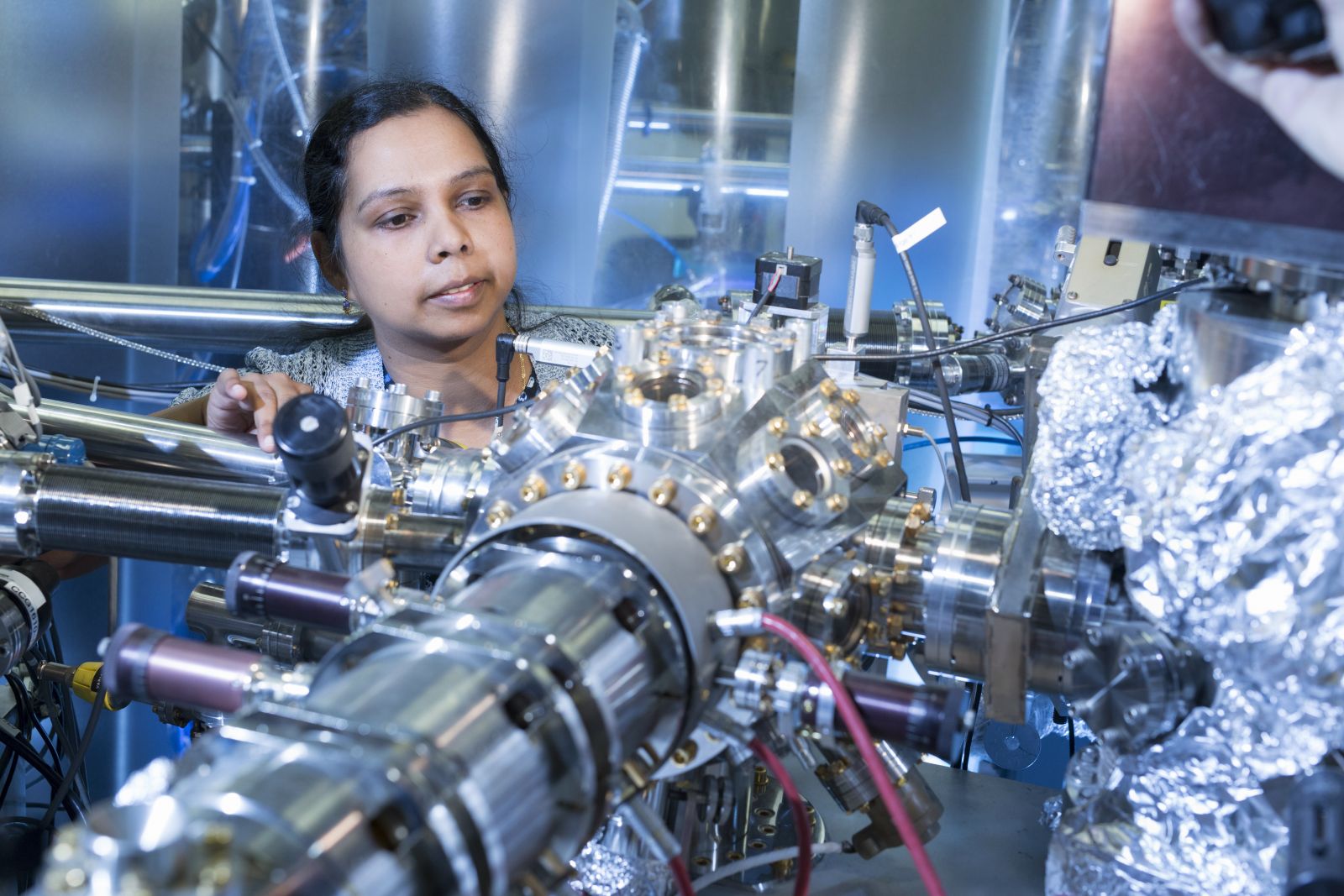 Karunakaran working with synchrotron science equipment.