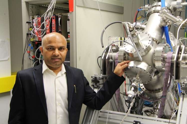 Dr. Harishchandra Singh, an adjunct professor at NANOMO and the Centre for Advanced Steels Research at the University of Oulu in Finland. He is standing next to steel components in the spectroscopy lab at NANOMO.